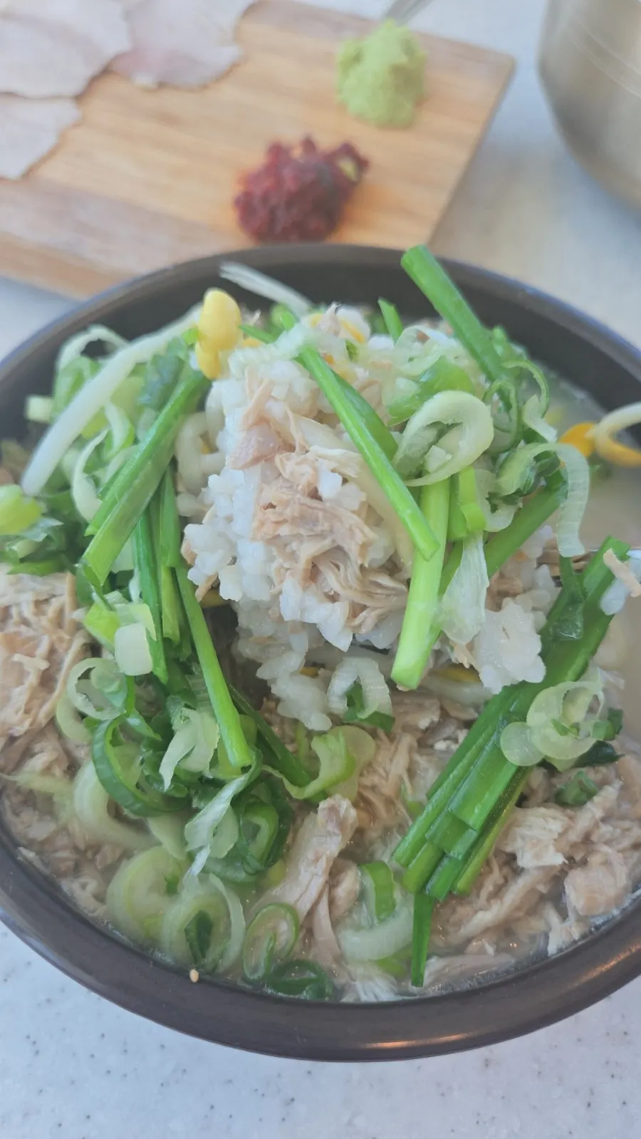 Dombe naengsuyuk served with wasabi and salted seafood