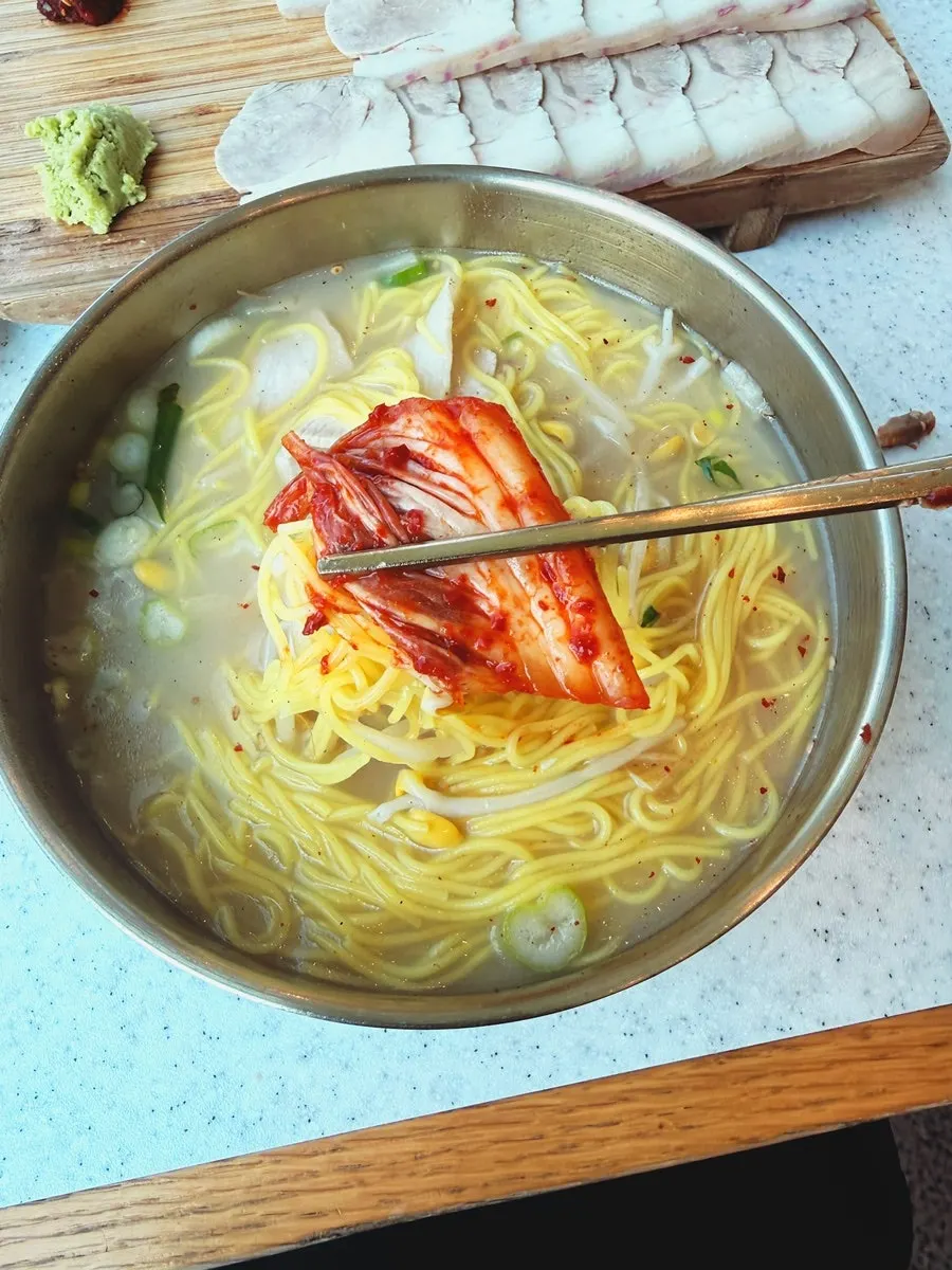 Noodles lifted up from the pork noodle soup