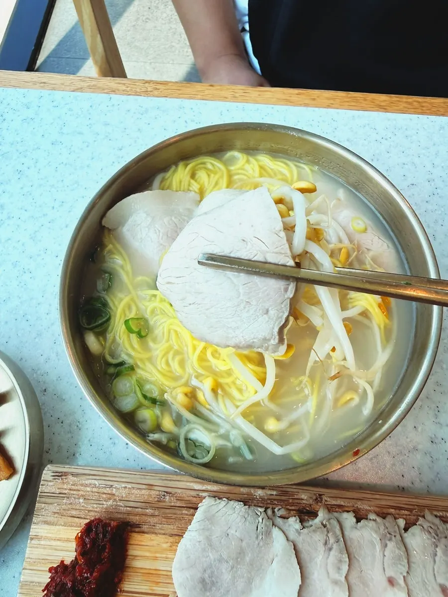 A generously portioned bowl of pork noodle soup