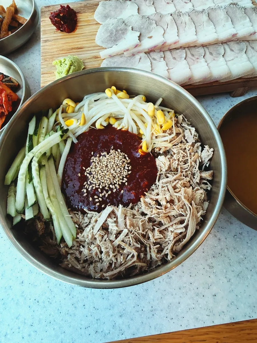 Dongchimi bibim noodles topped with minced meat