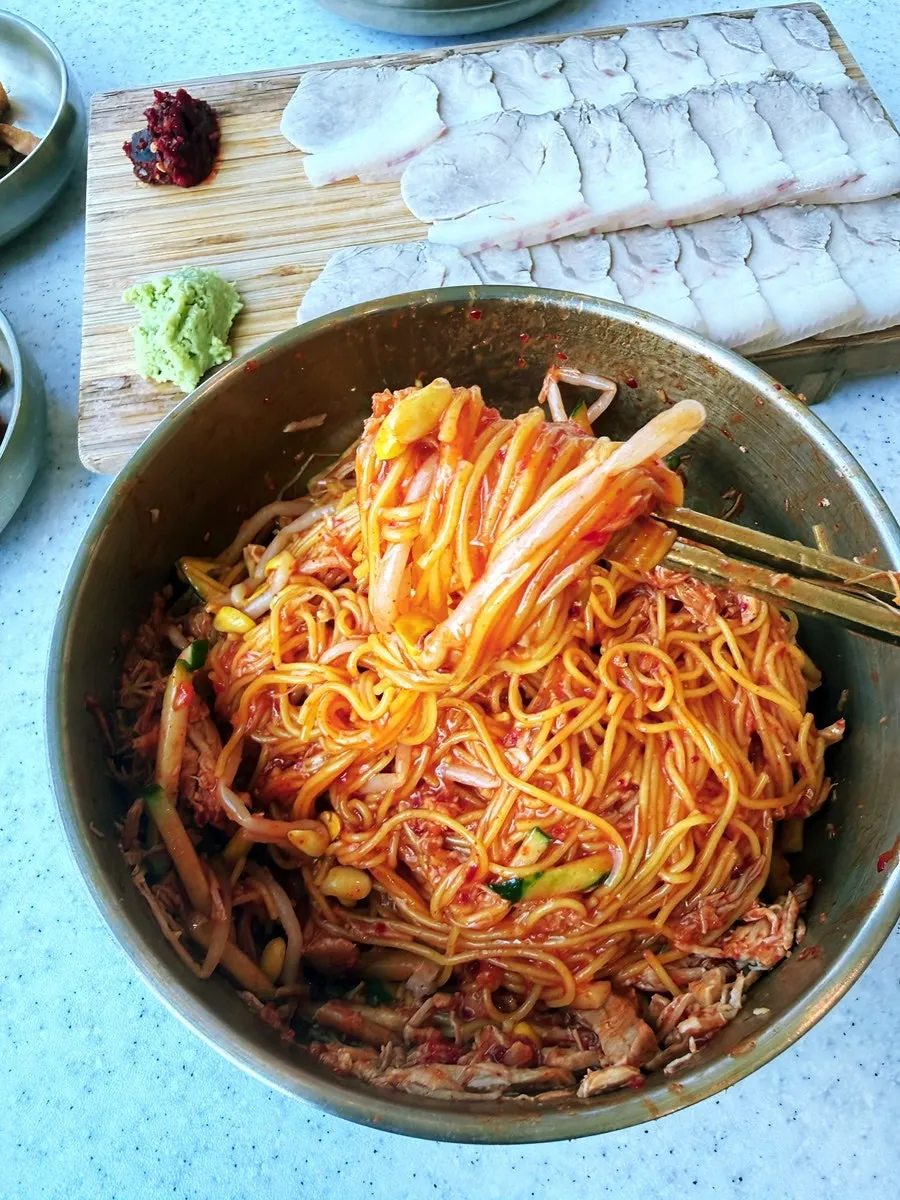 Noodles lifted up from the dongchimi bibim noodles