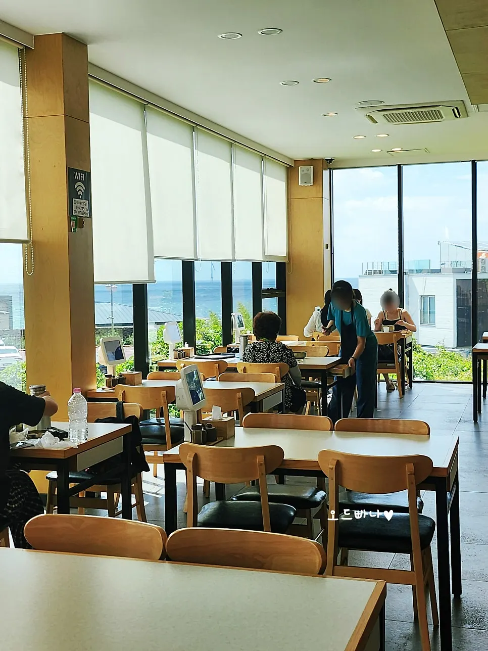 Interior view of Handam Guksu's full ocean-view windows