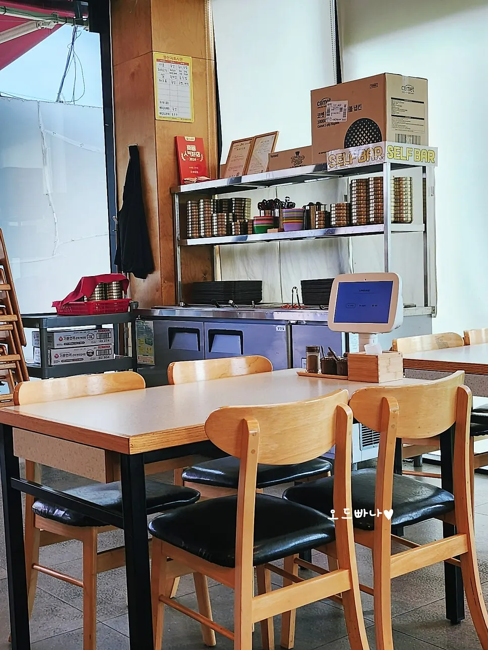 Spacious dining hall with ocean views through the windows