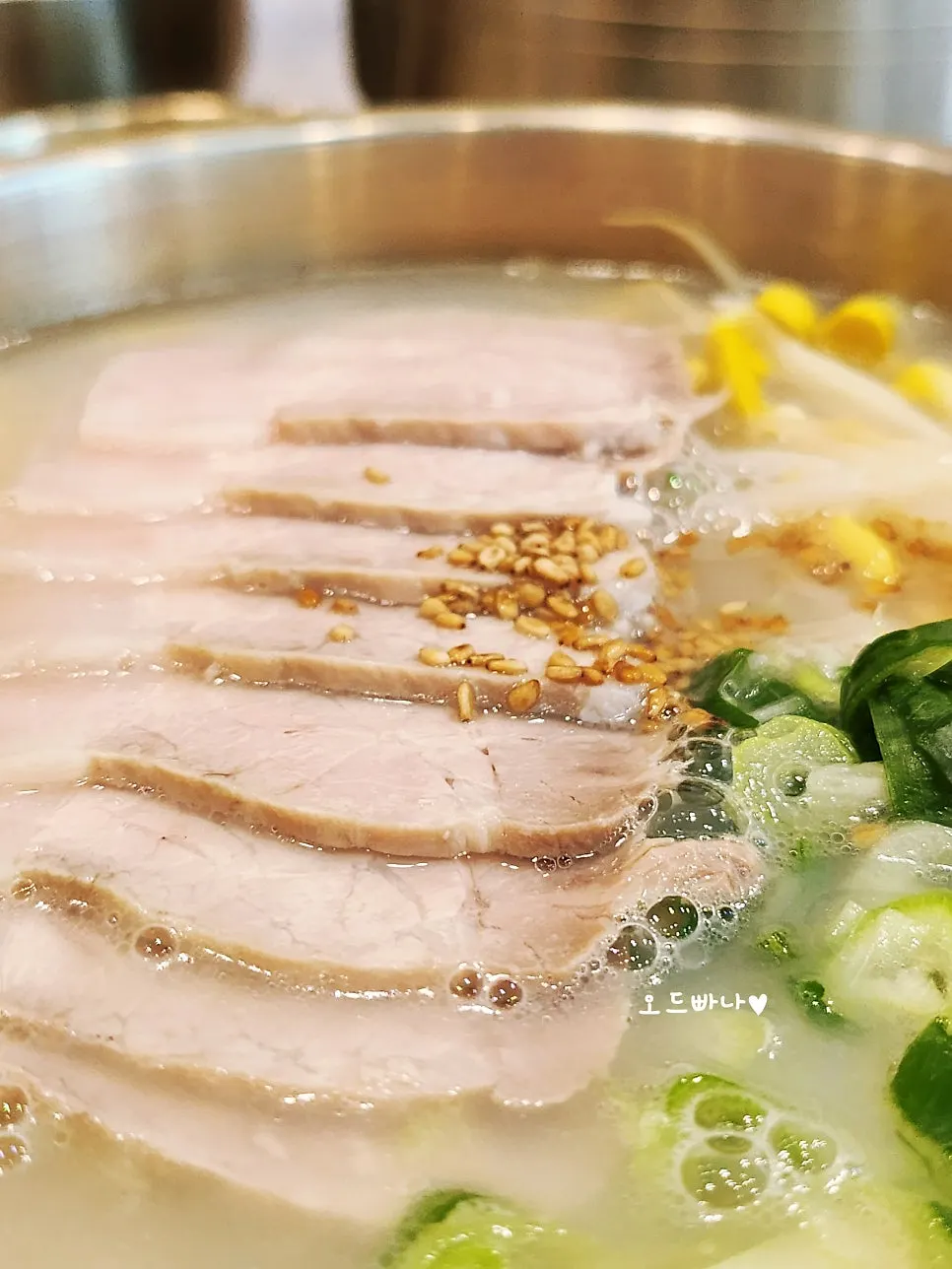 Close-up of bone broth and meat toppings