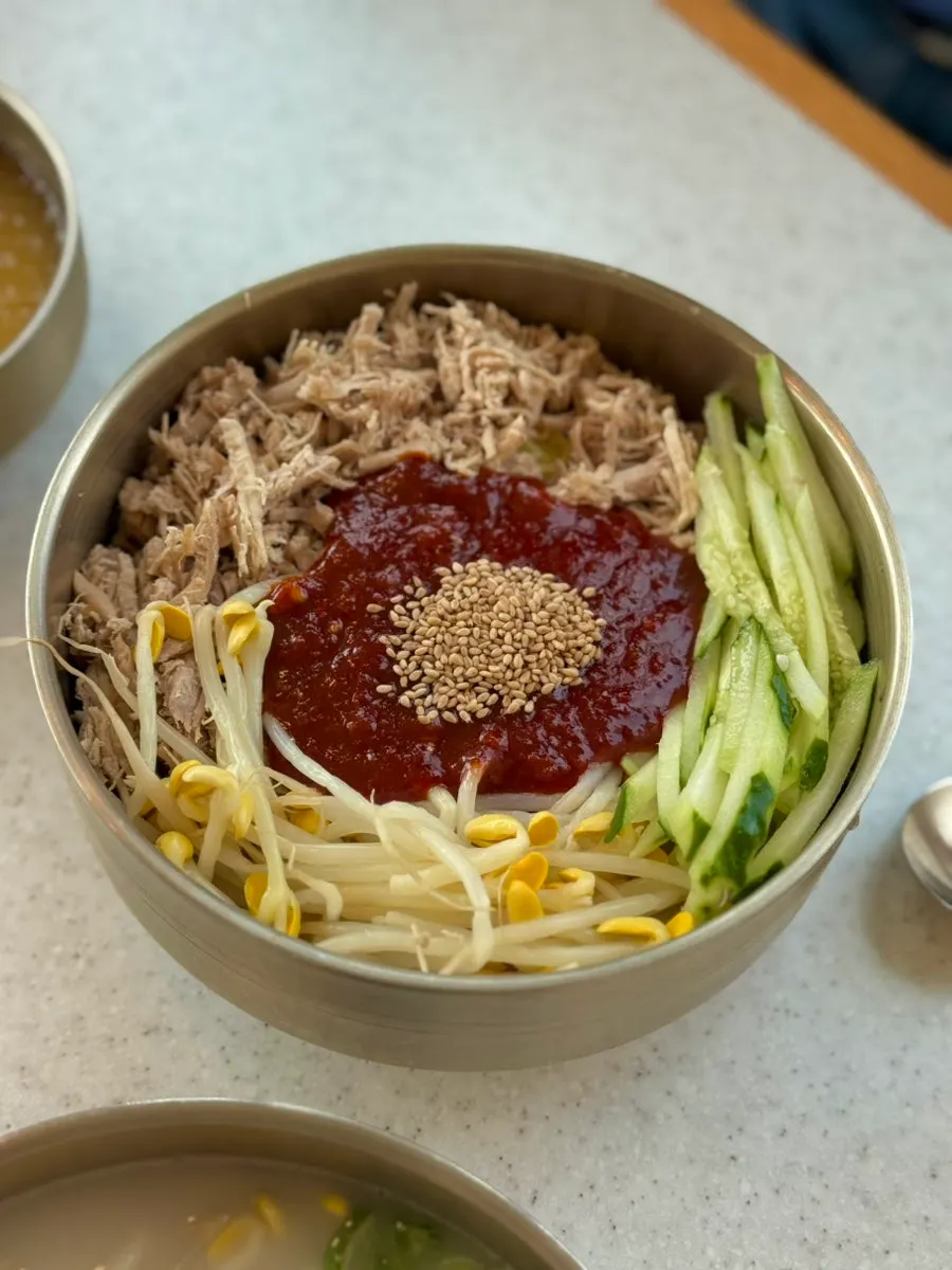 Pork noodle soup with boiled pork and noodles lifted up