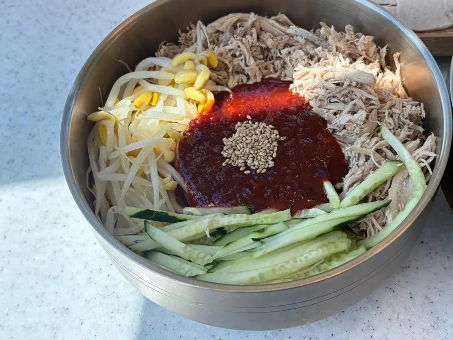 Dongchimi bibim noodles mixed with the sauce