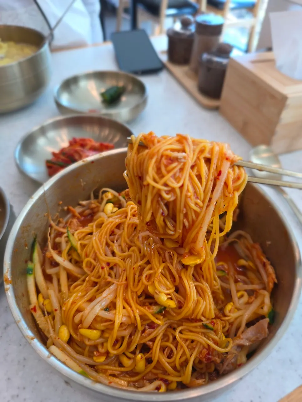 A chopstick-full of bibim noodles
