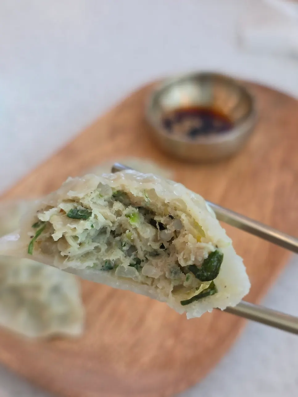 Pork mandu dipped in soy sauce
