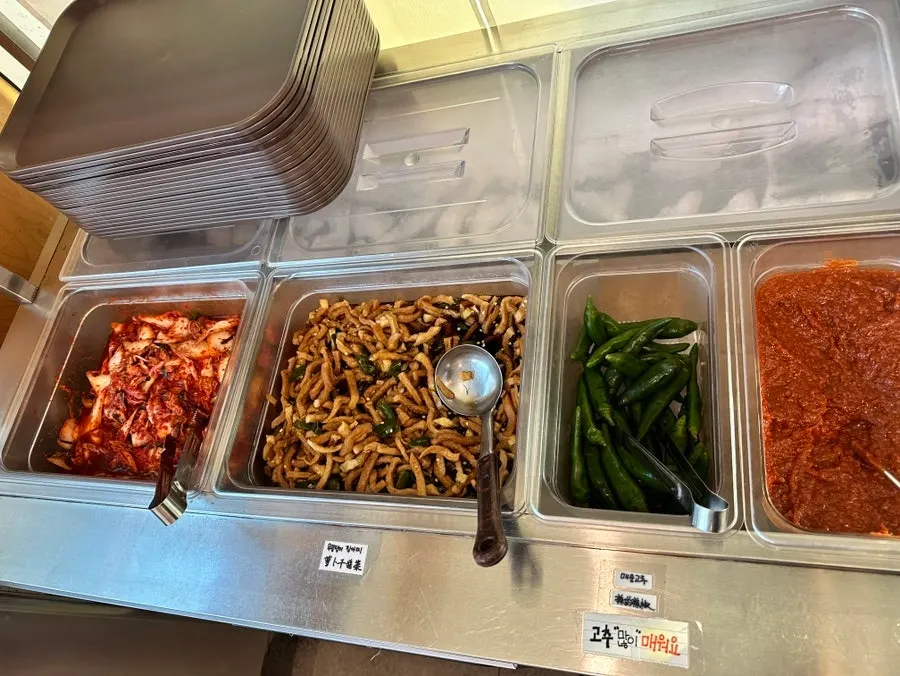 Menu listing tteokgalbi and pork mandu