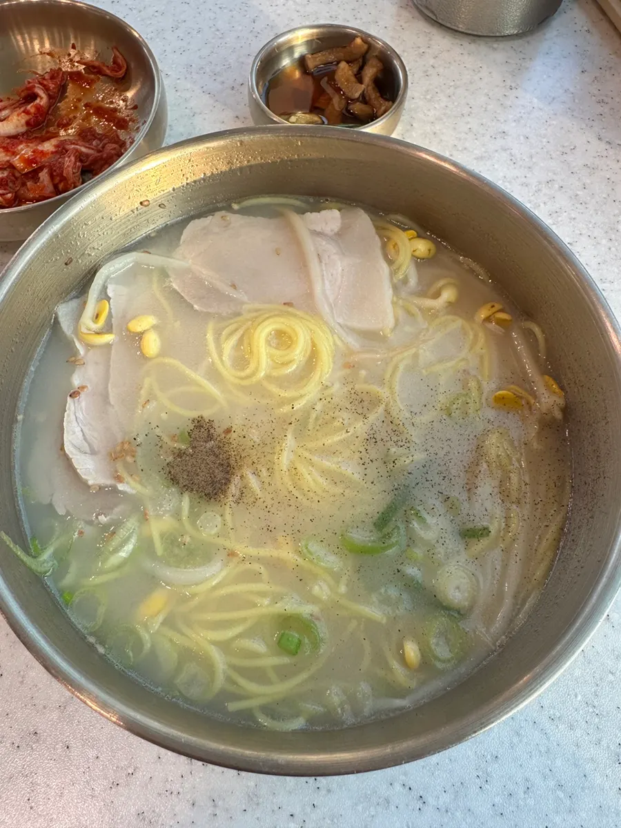 Pork noodle soup served with chili pickles
