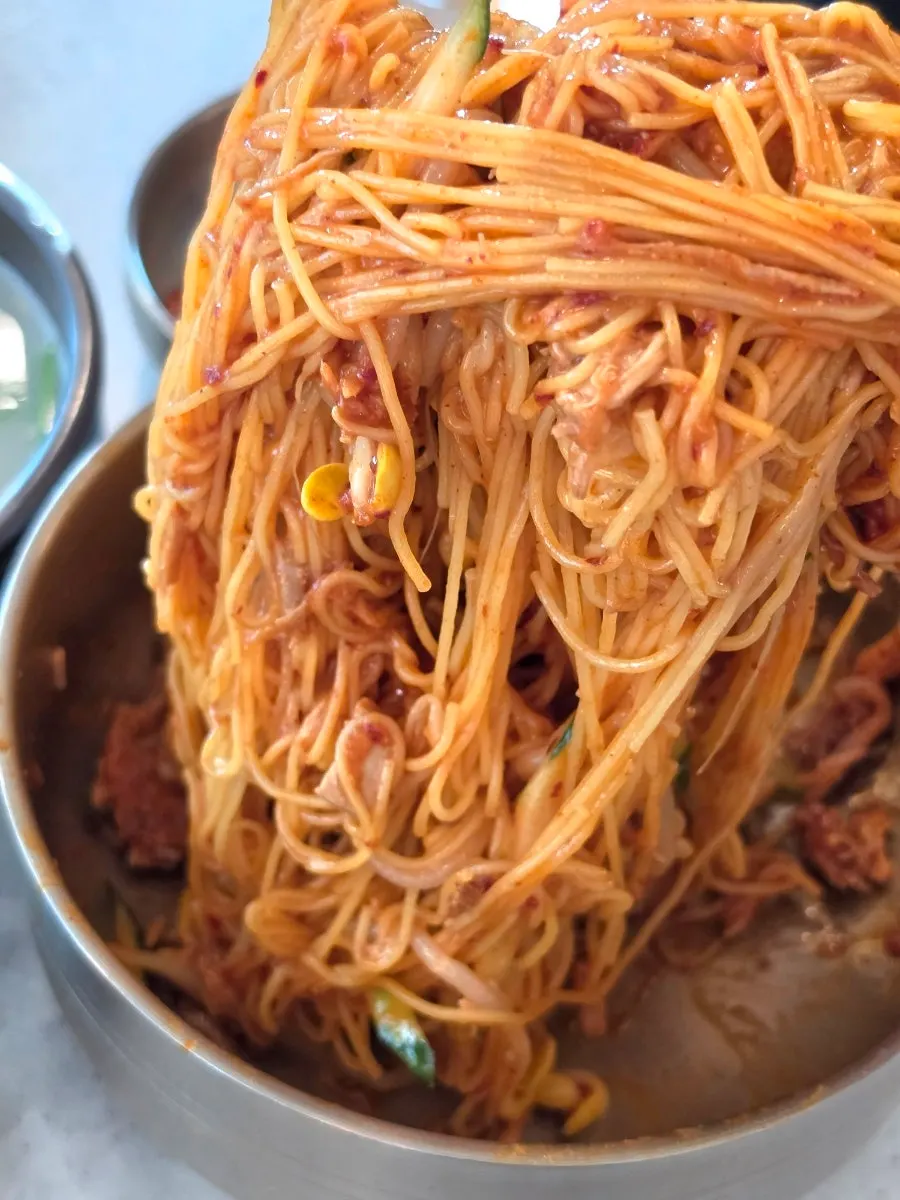 Mixing the bibim noodles