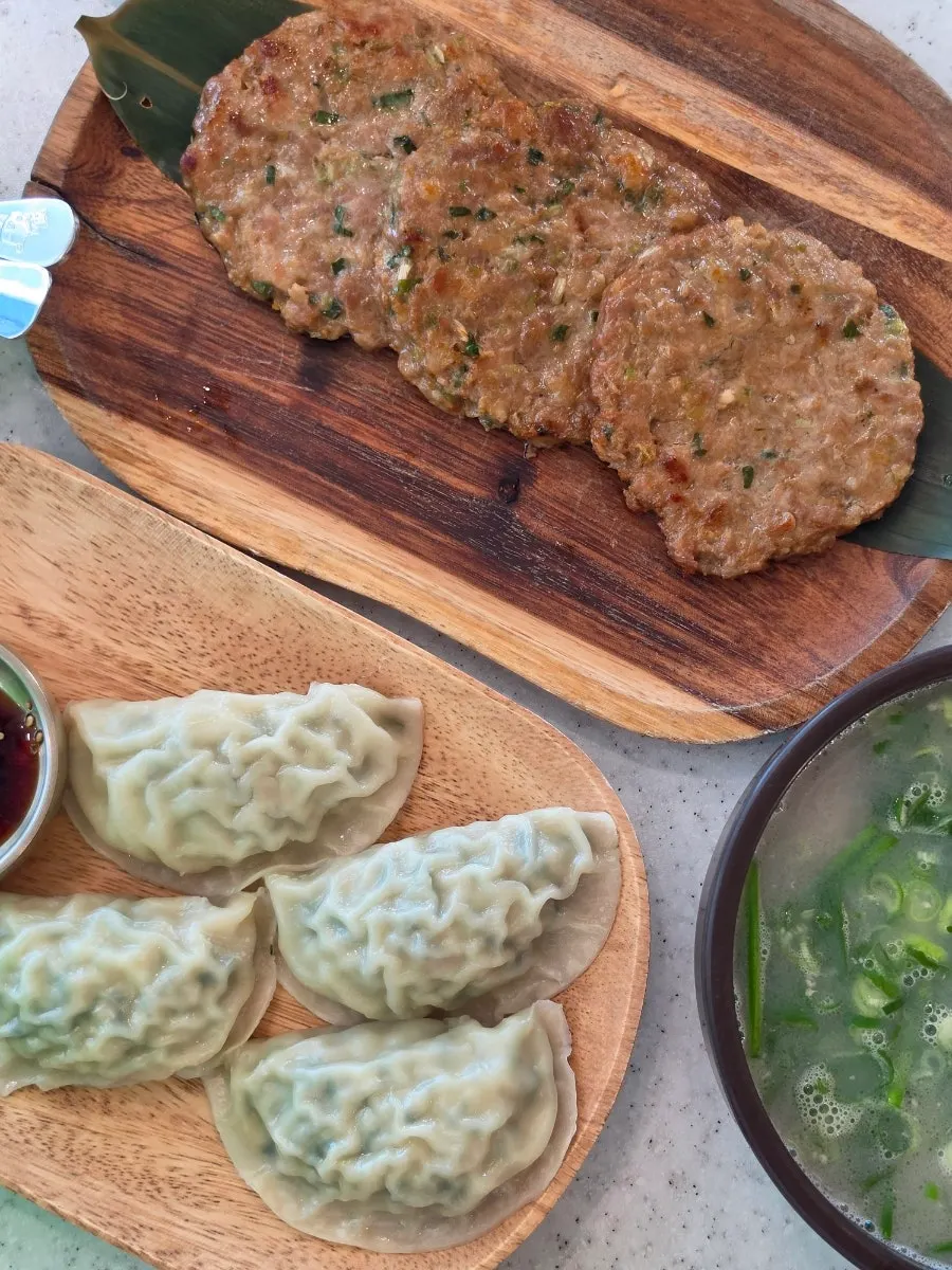 Tteokgalbi served alongside the noodles