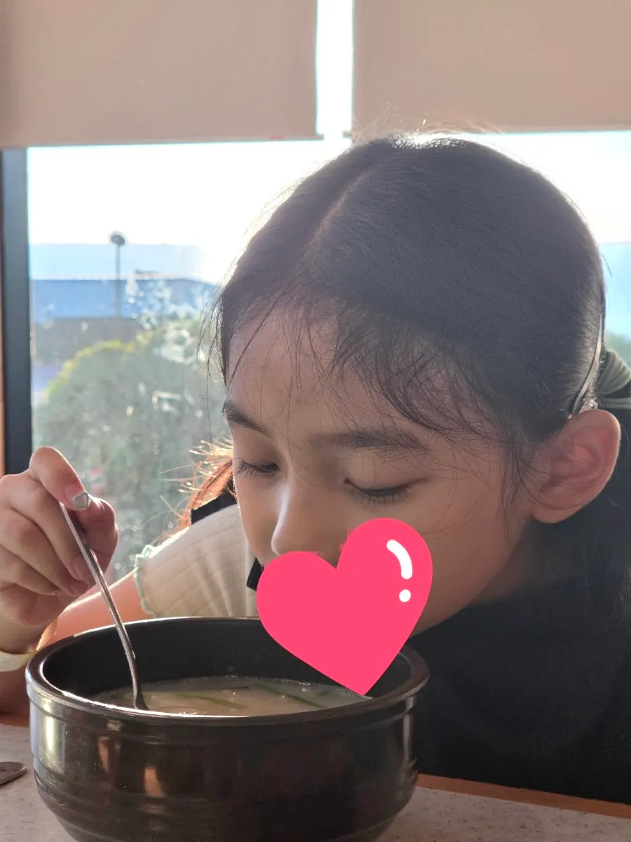 A child eating with kids' tableware