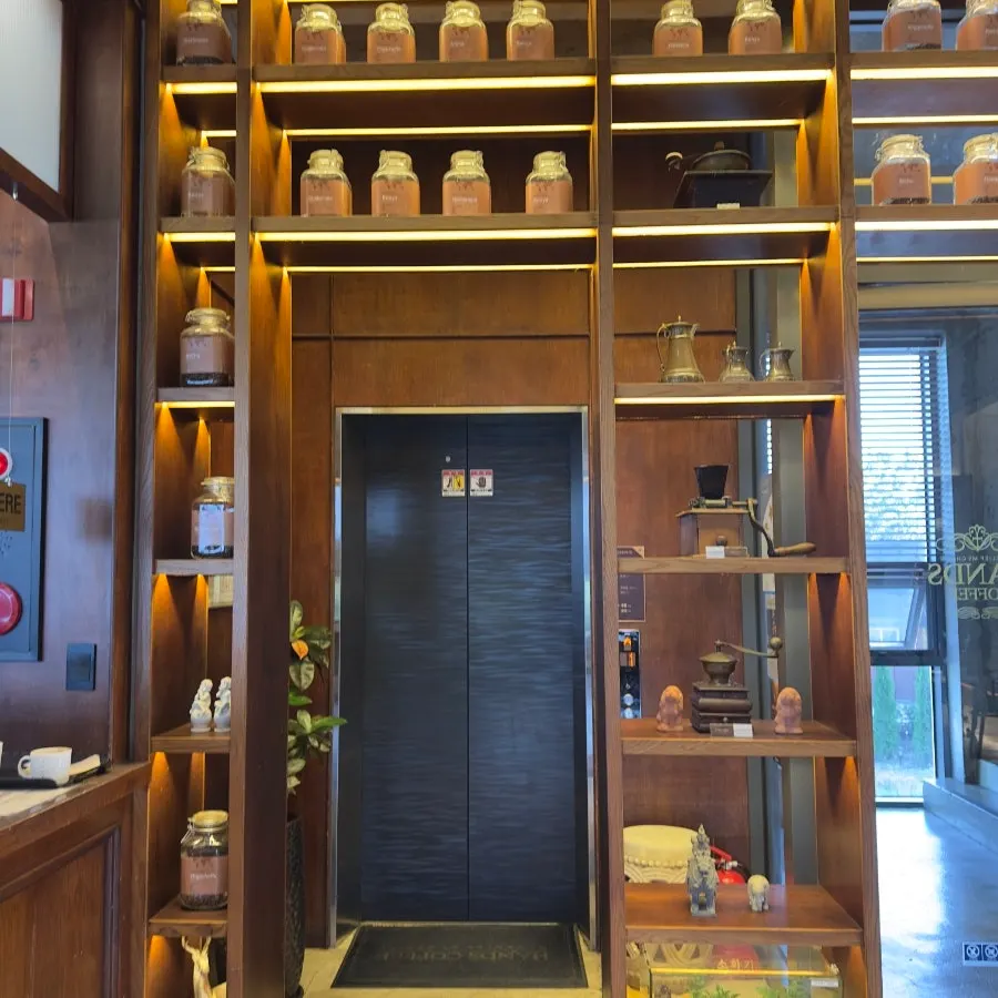 Interior staircase and floor signage inside Hands Coffee Dongchon Resort Branch