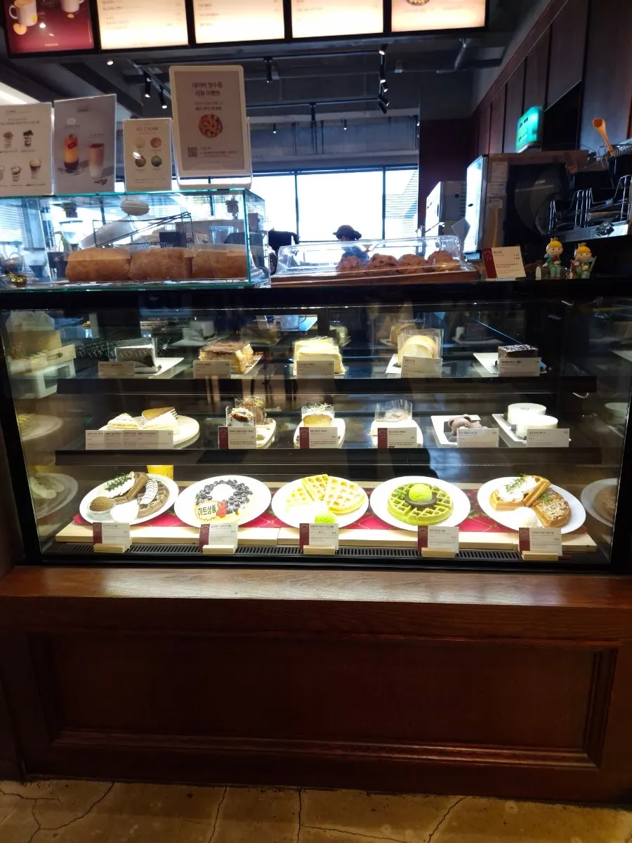 Order counter with waffles and cakes on display