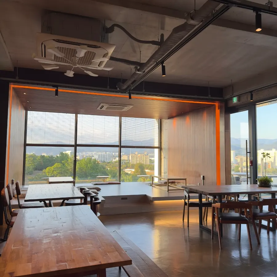 Floor-seating table by the floor-to-ceiling window