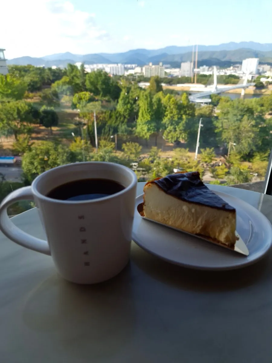 Coffee and cheesecake enjoyed with the floor-to-ceiling window view