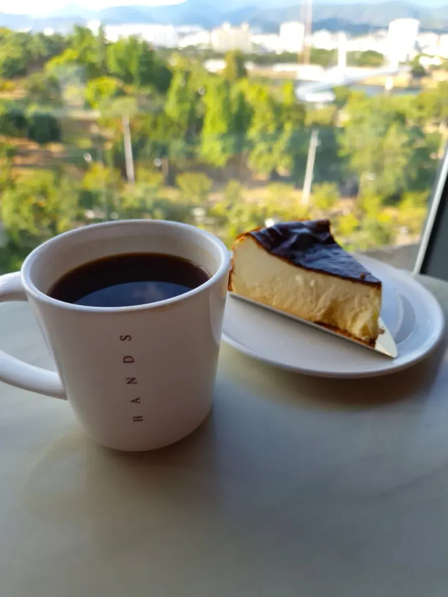 Closing shot of café seating with the outdoor view in the background