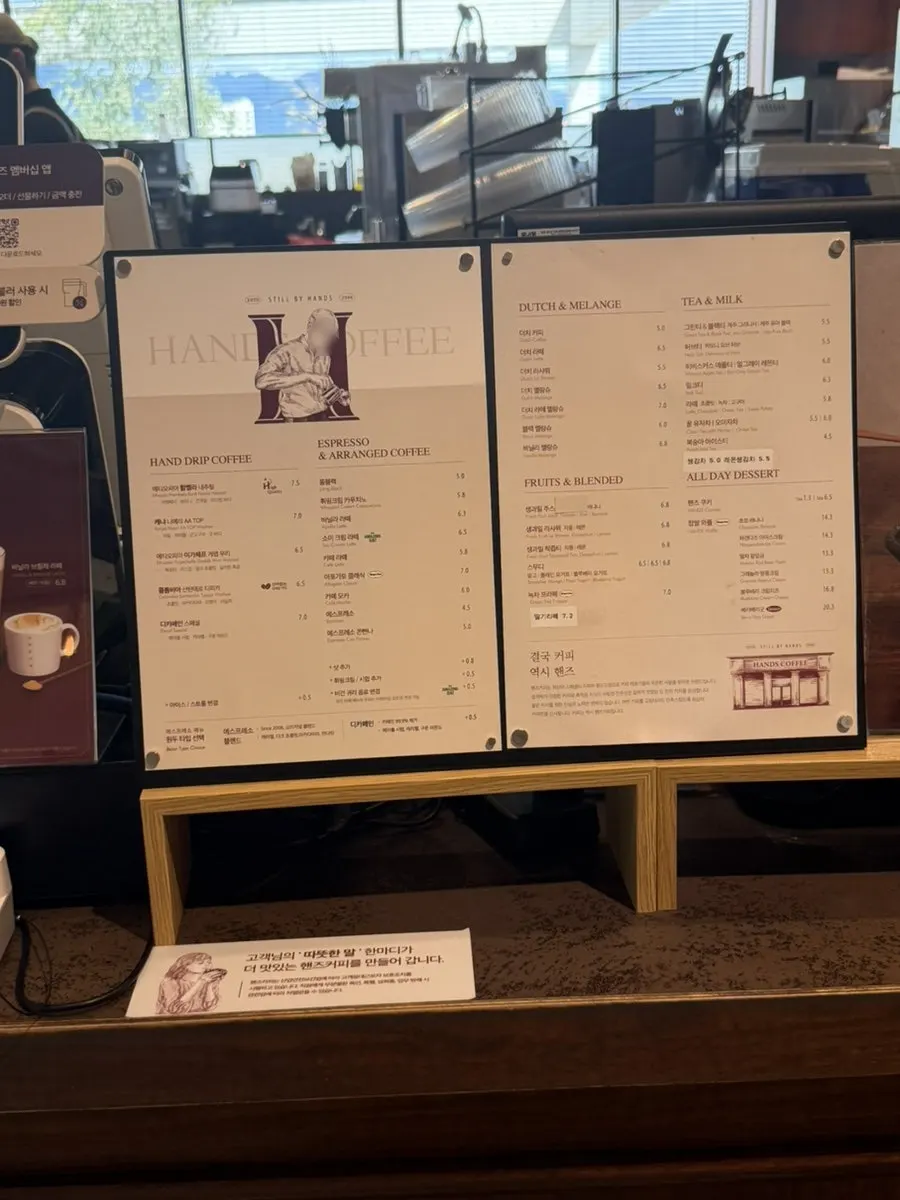 Menu board listing waffles and brunch items