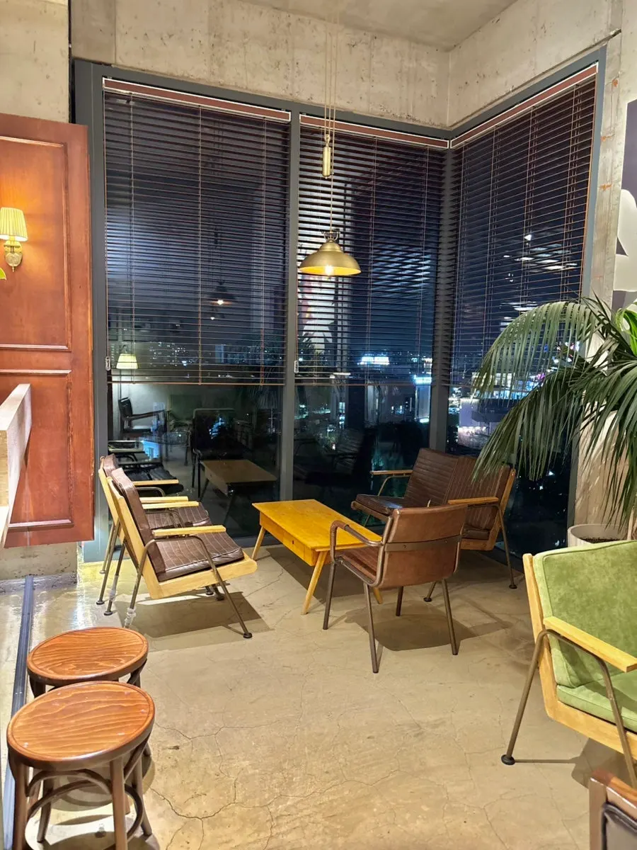 Well-spaced tables on the 3rd floor at Hands Coffee