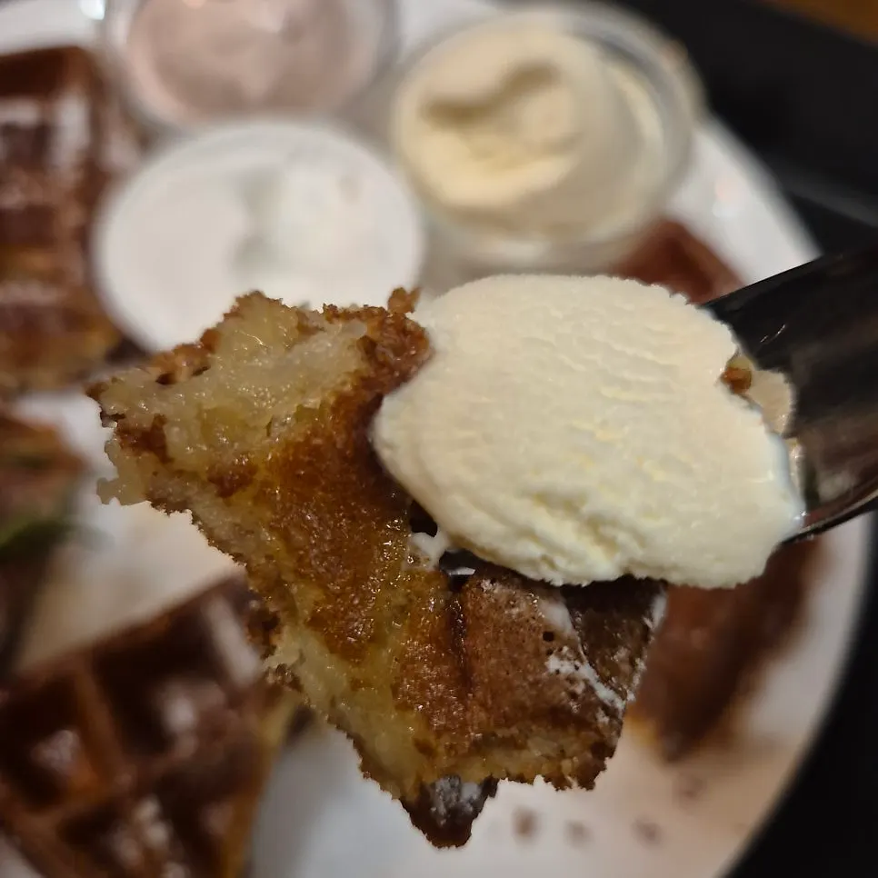 Glutinous rice waffle topped with ice cream and whipped cream