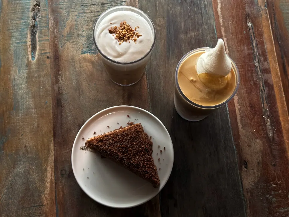 Soy cream latte, ice cream café latte, and Malenka on the table
