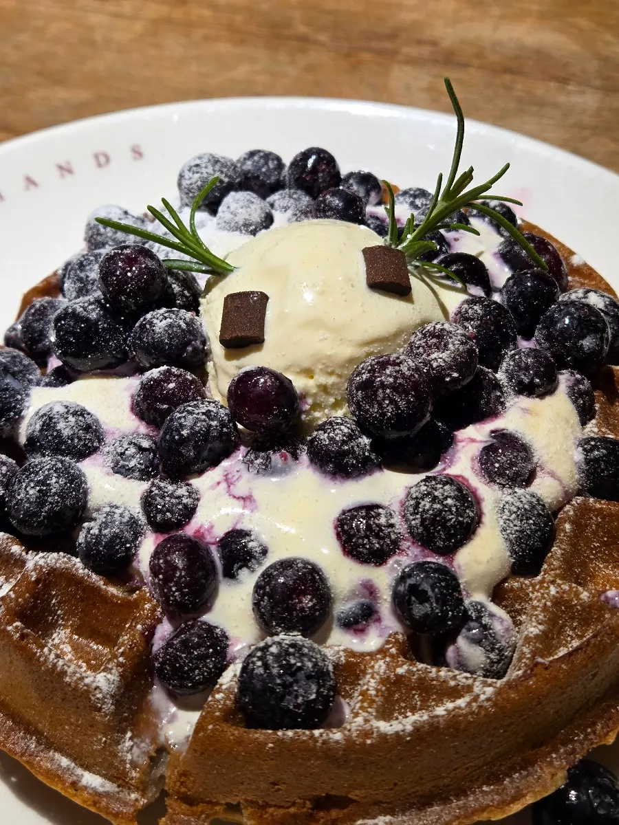 A plate of blueberry cream cheese waffle