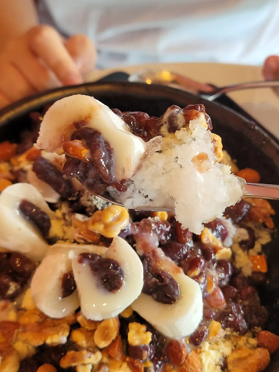 Close-up of the bingsu piled high with whole red beans