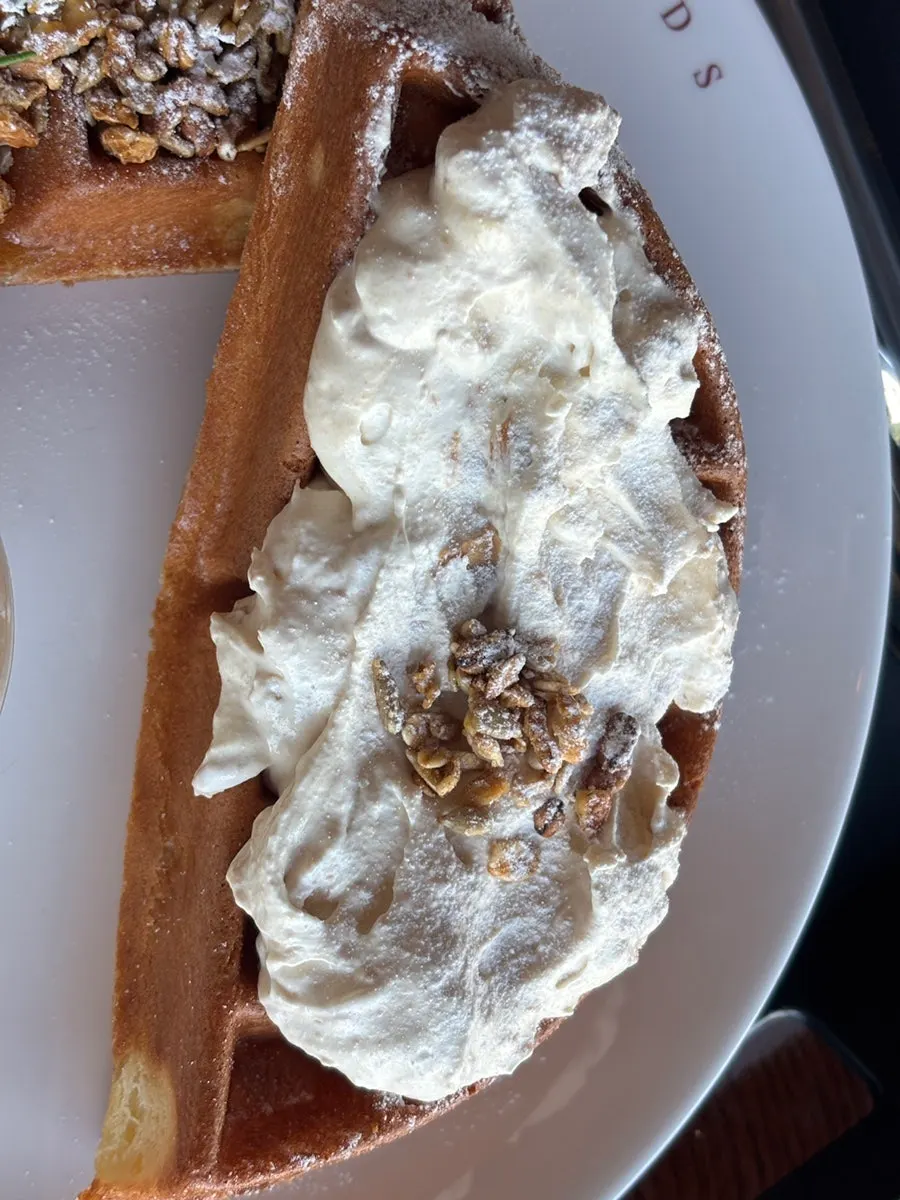 Table with the waffle and iced long black together