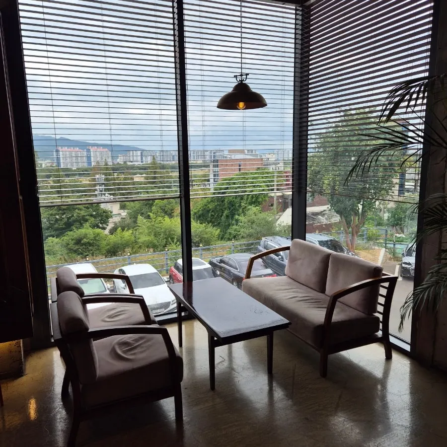 Café window seat next to floor-to-ceiling glass