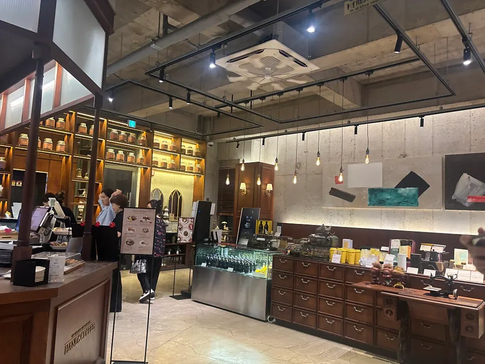 High-ceilinged wood-toned café interior