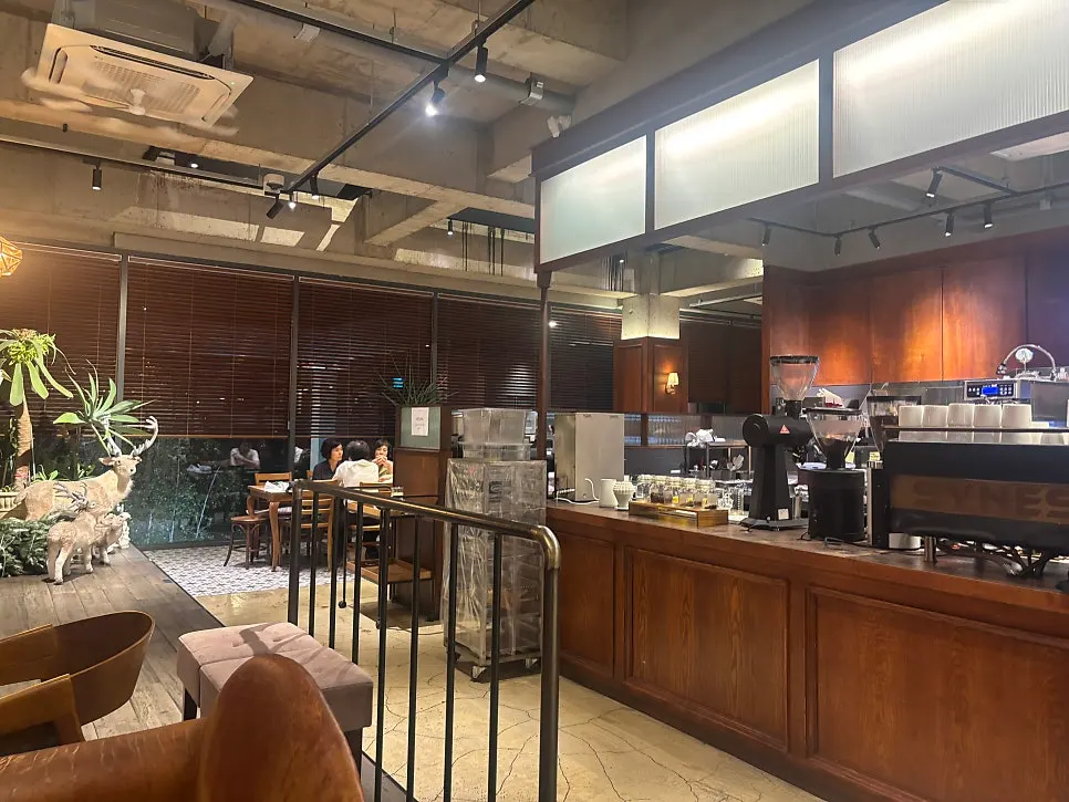 Café seating arranged with generous spacing