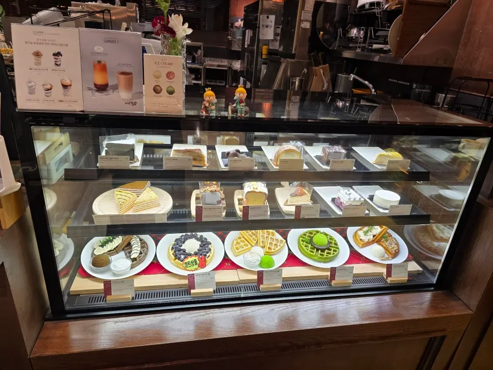 Dessert showcase filled with cakes and waffles