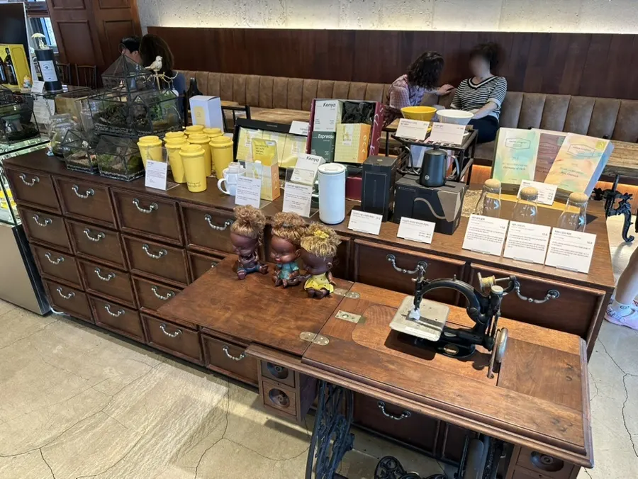 Decorative items and retail area at Hands Coffee