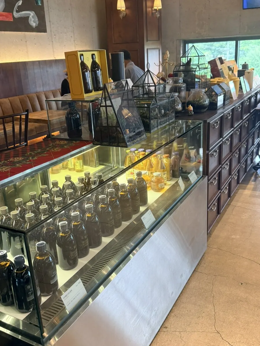Café display shelf with cold brew and merchandise