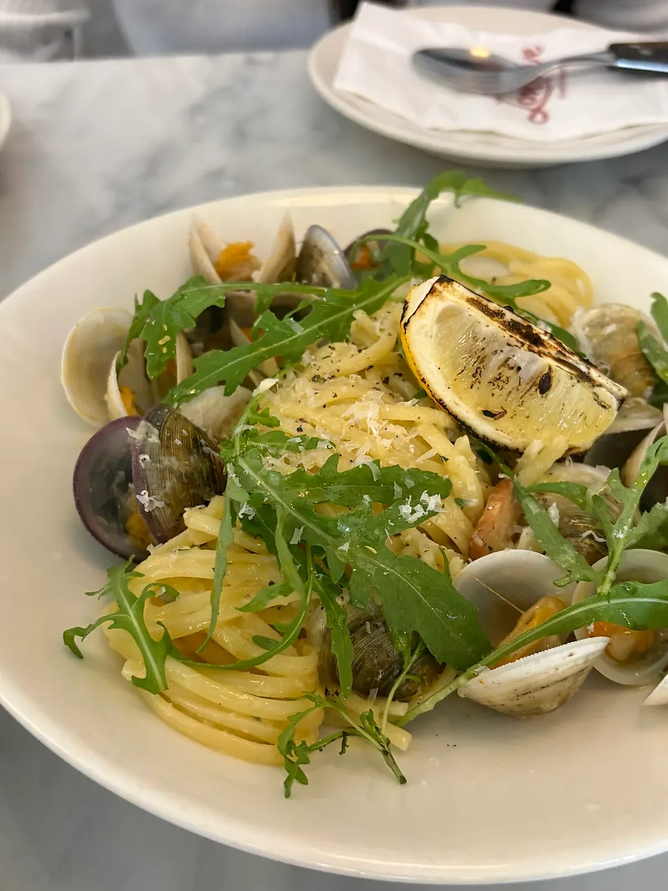 Vongole pasta noodles wound around a fork