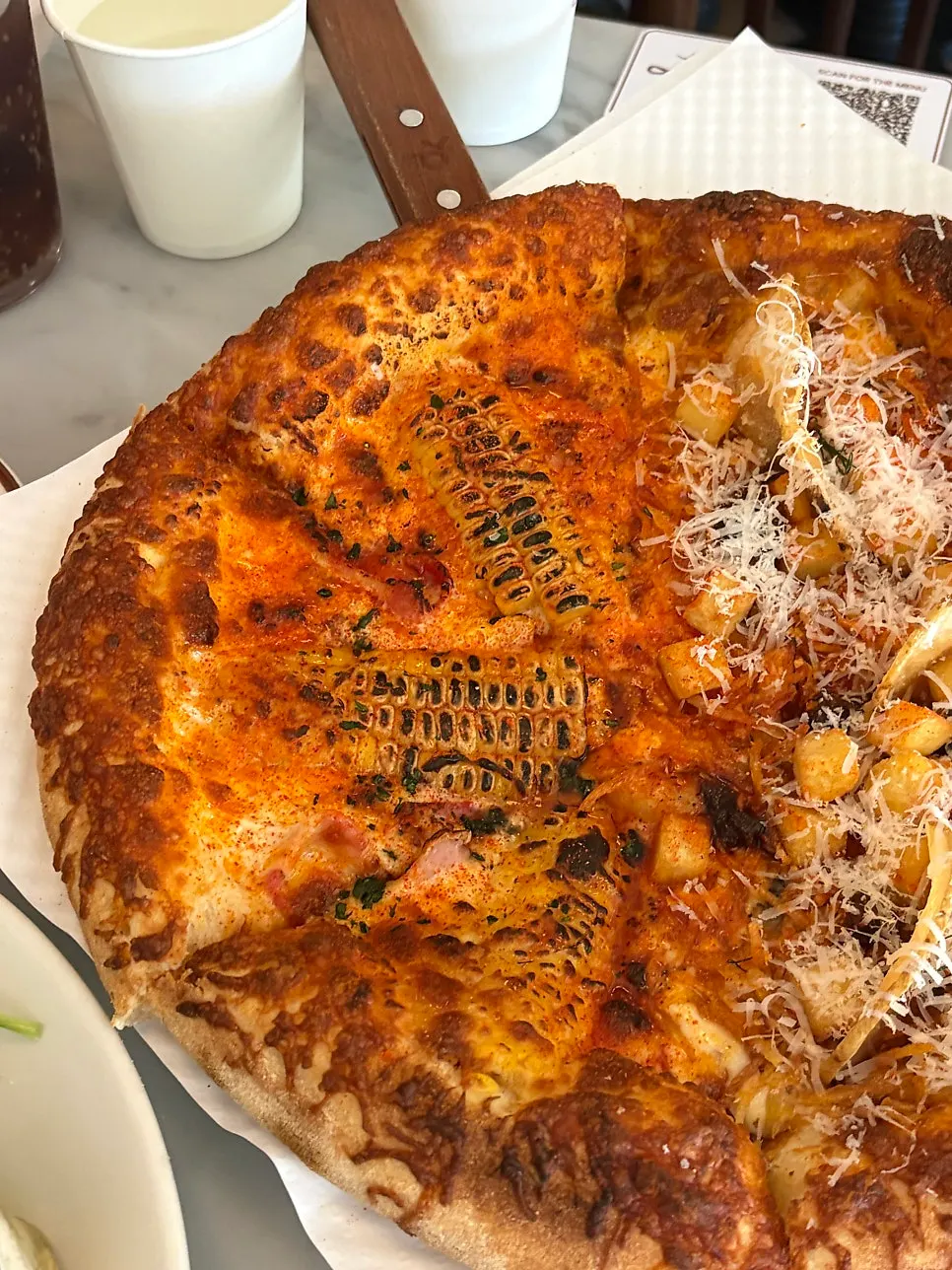 Pizza and pasta placed together on the table
