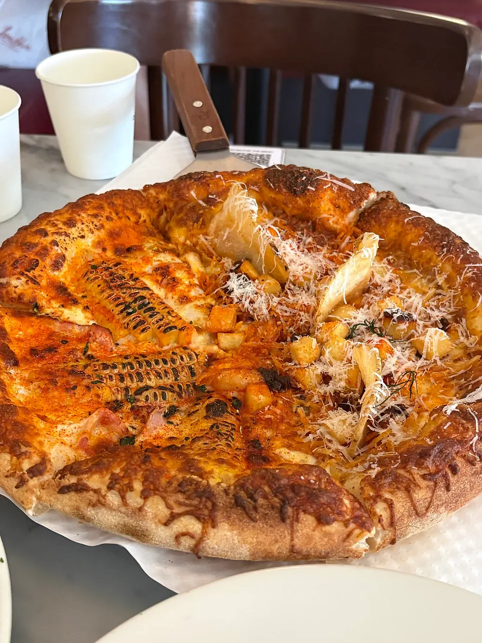 Cross-section of pizza showing the crispy, chewy dough