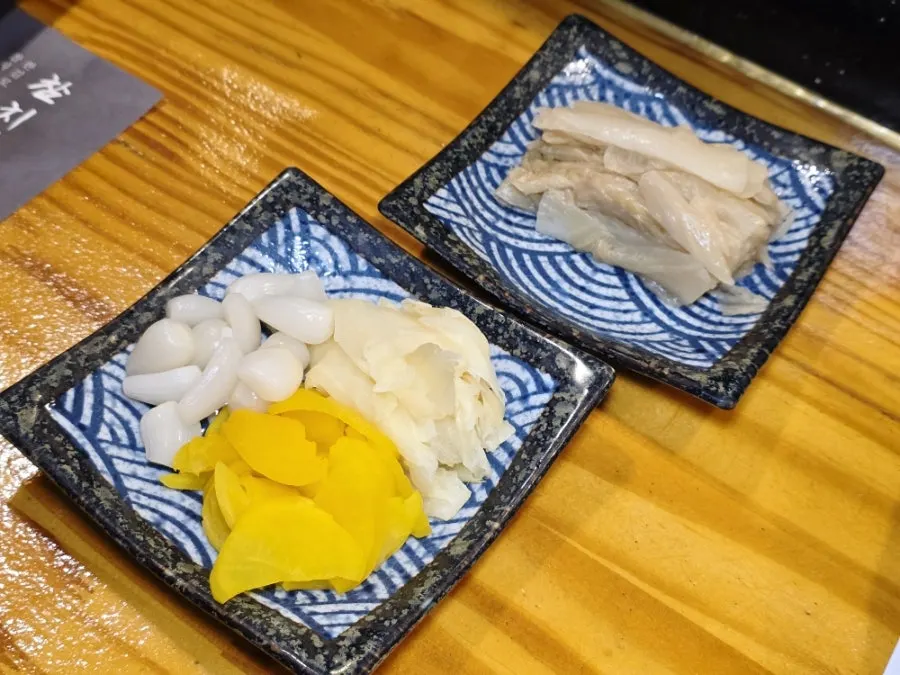 Dried seaweed with white kimchi, pickled radish, pickled ginger, and rakkyo