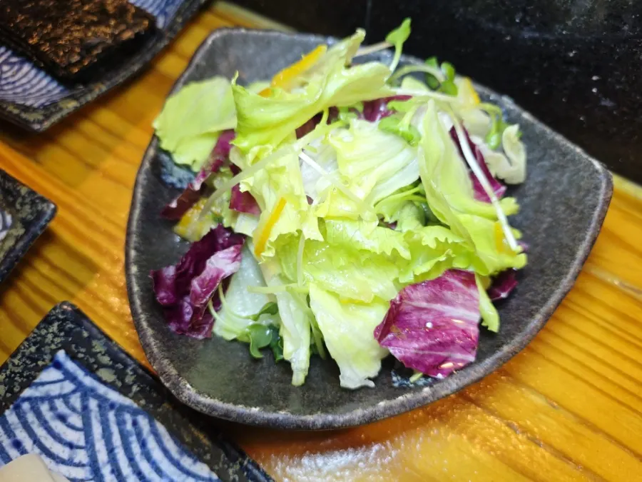 Salad drizzled with yuzu dressing
