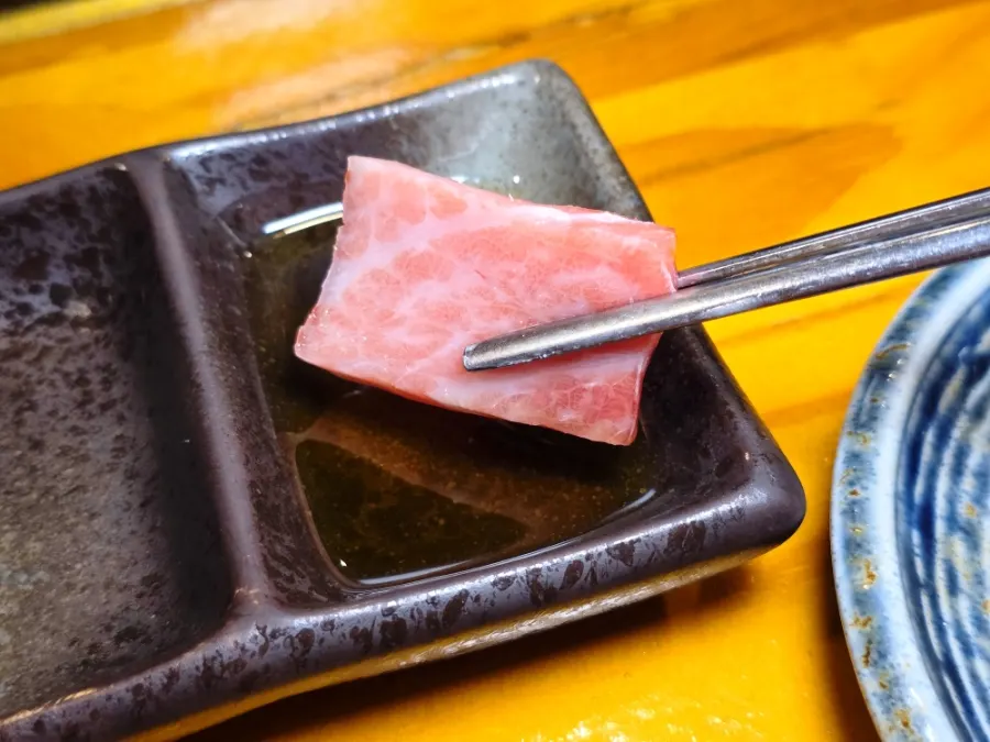 A piece of marbled tuna sashimi