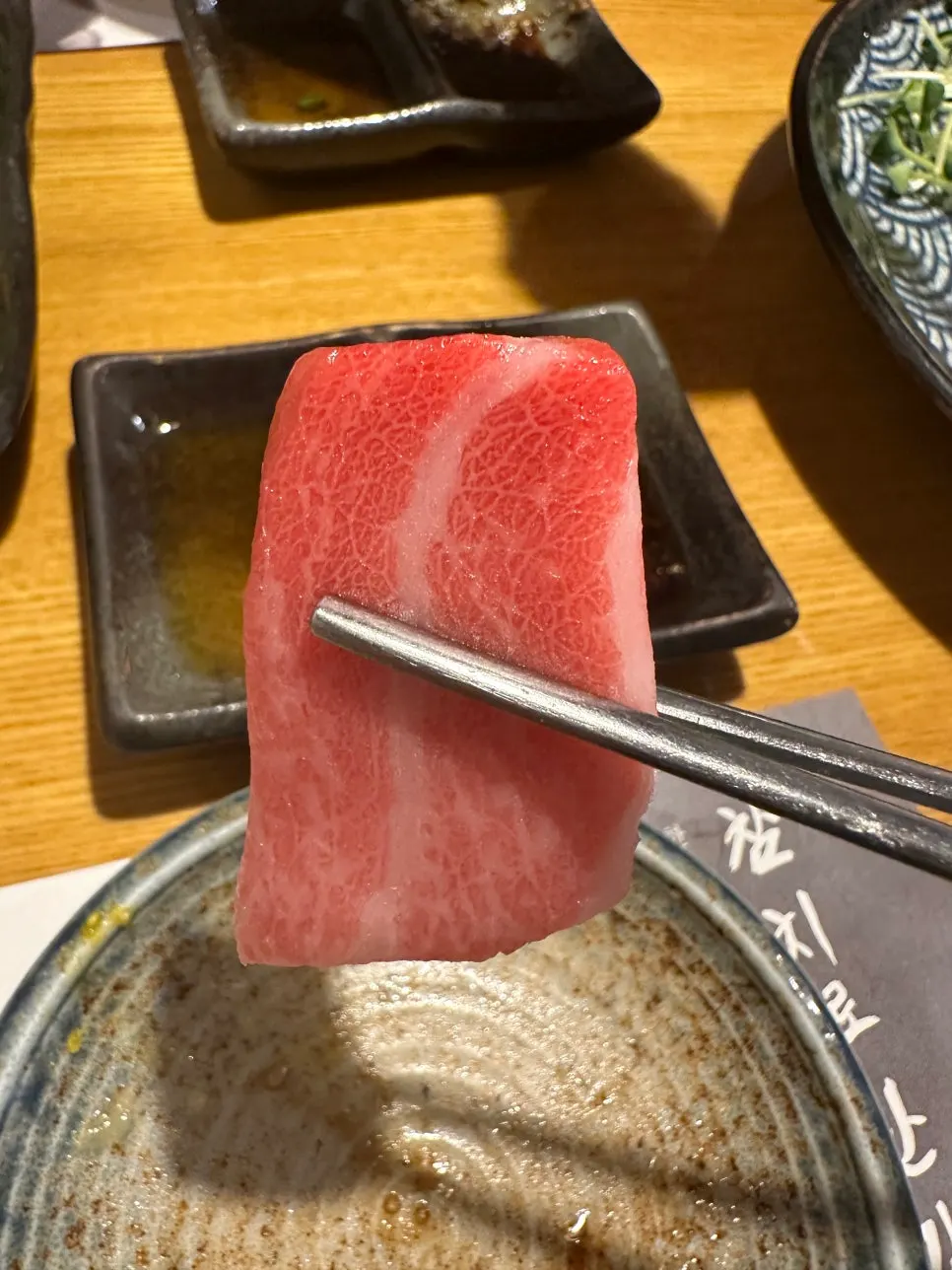 Tuna sashimi plate being emptied out