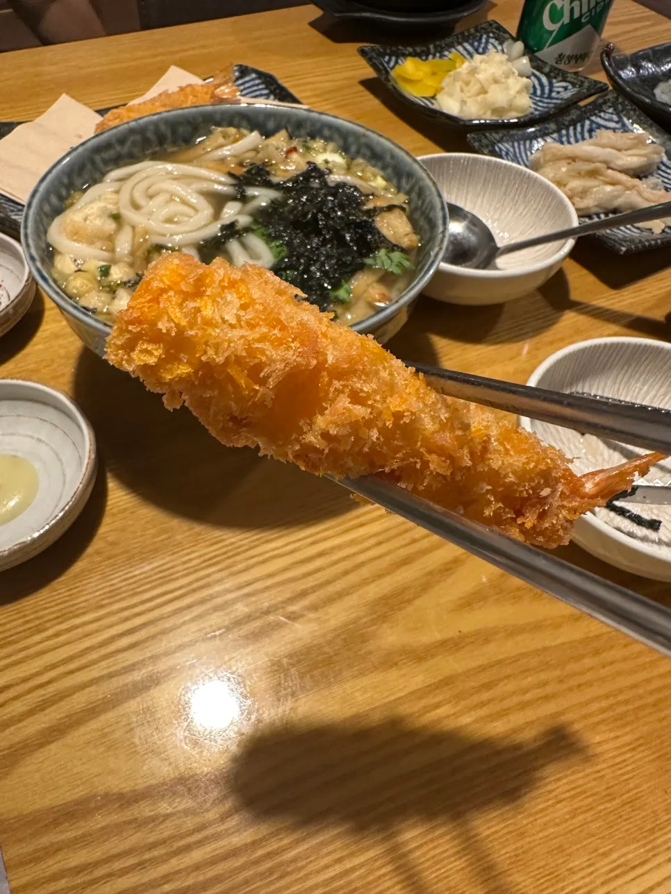 Udon with fried tofu and fish cake alongside fried shrimp