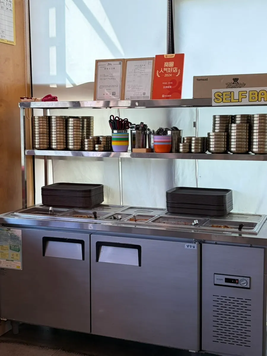 Self-service bar stocked with side dishes