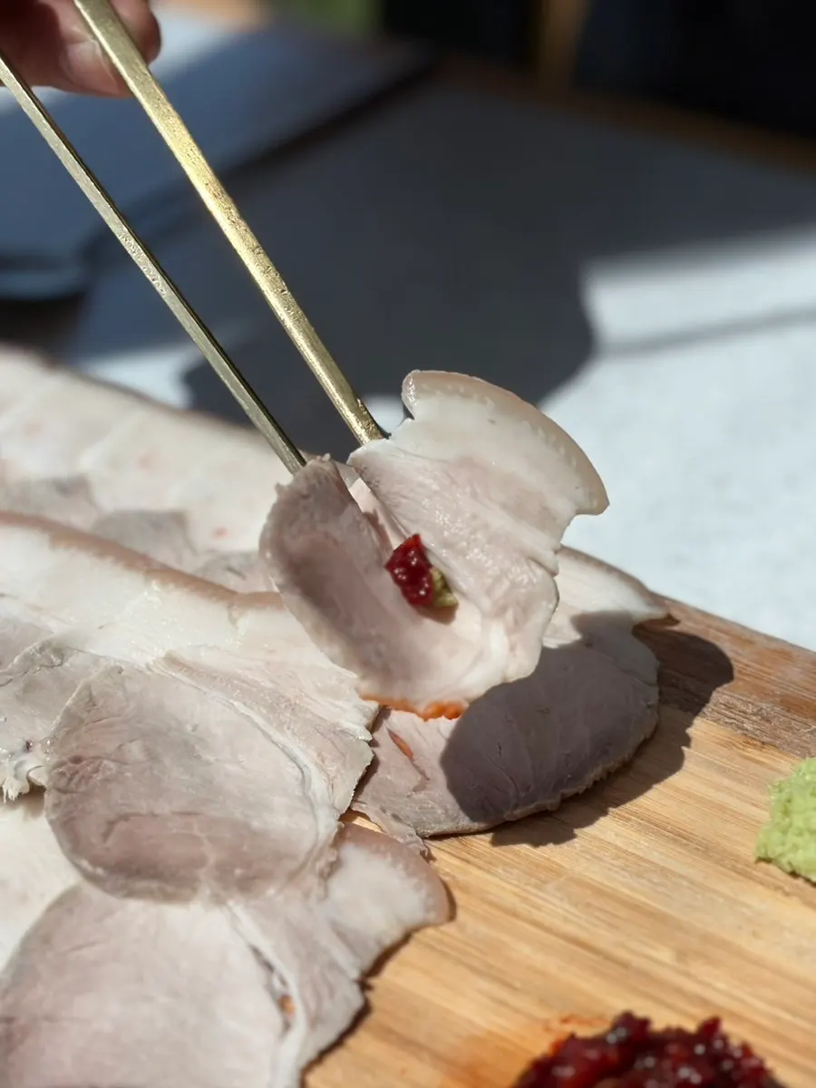 Dombe cold pork served on a cutting board