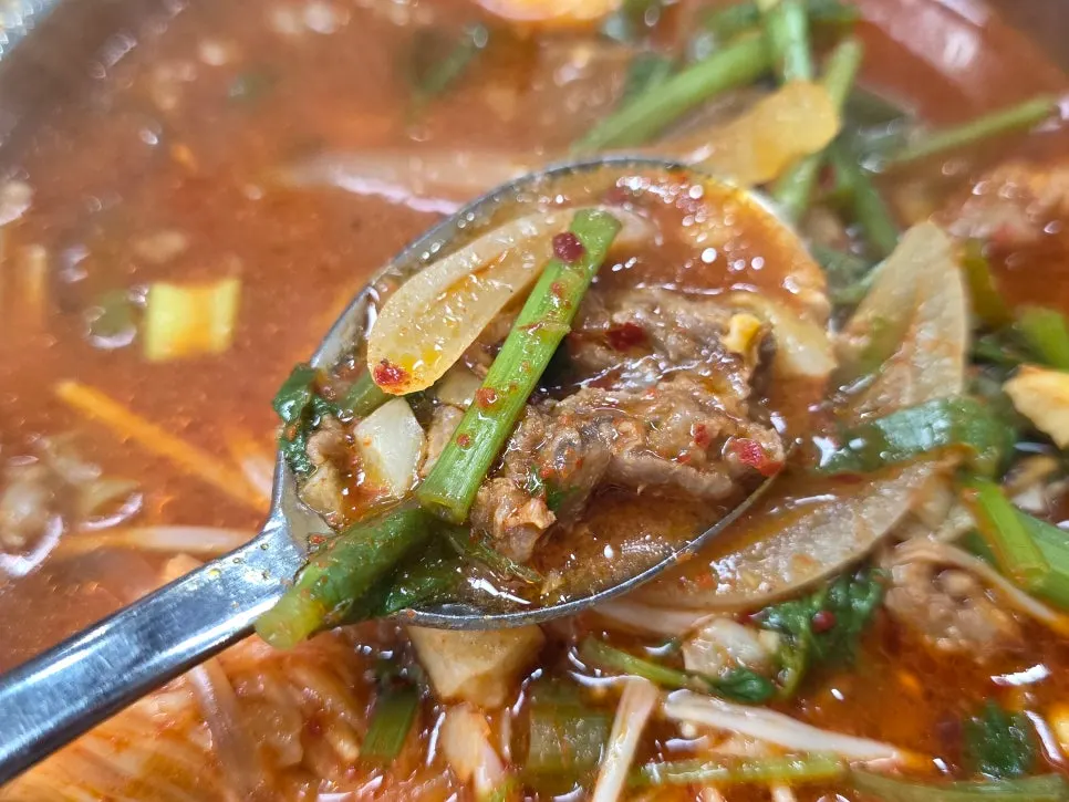 Beef and glass noodles scooped into a bowl