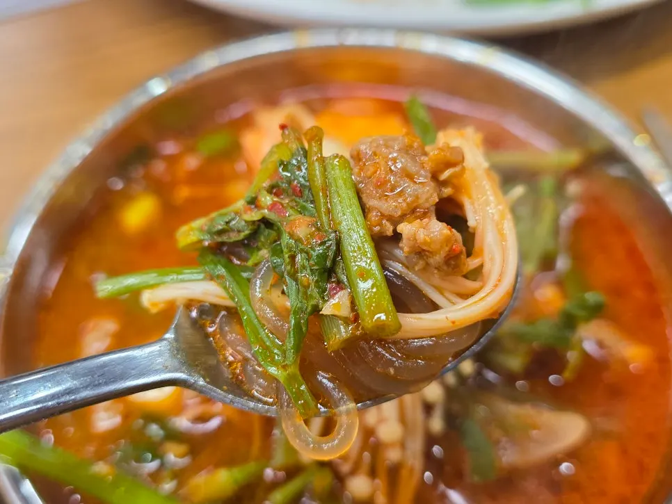 Mild beef stew served with a bowl of rice