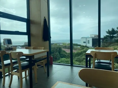 Interior view of Handam Beach through the floor-to-ceiling windows