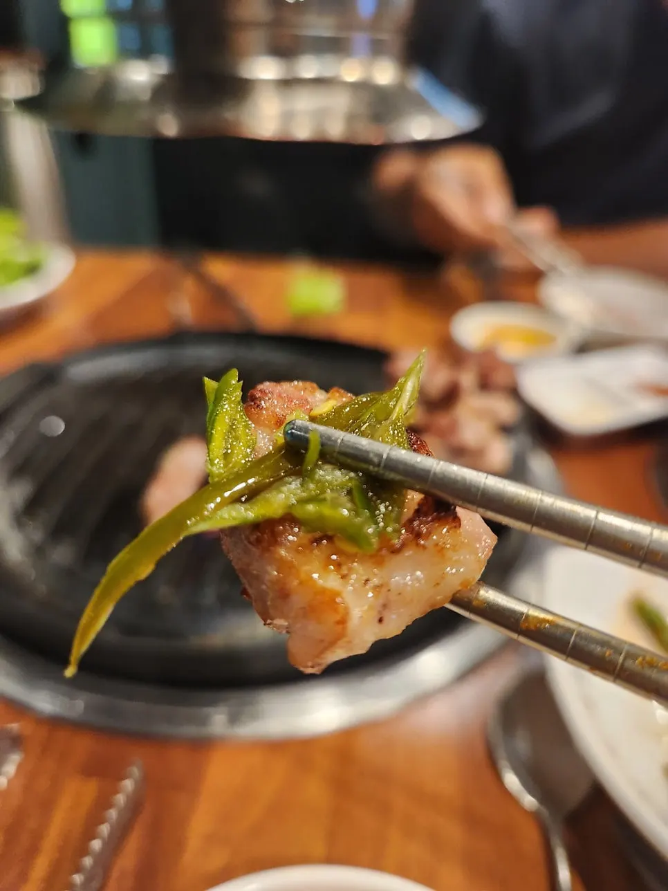 Aged pork belly wrapped in lettuce
