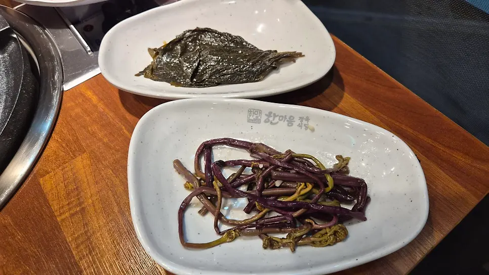 Plate of wrap greens, ssamjang, and garlic